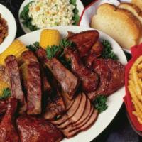 Woody'S Family Feast For 4 · Family-sized portions of bbq pork, bbq chicken and spare ribs served with bbq beans, creamy ...
