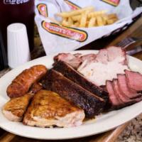 A Taste Of Woody’S · Enjoy this heaping platter of spare ribs, bar-b-q pork, texas beef brisket, smoked turkey br...