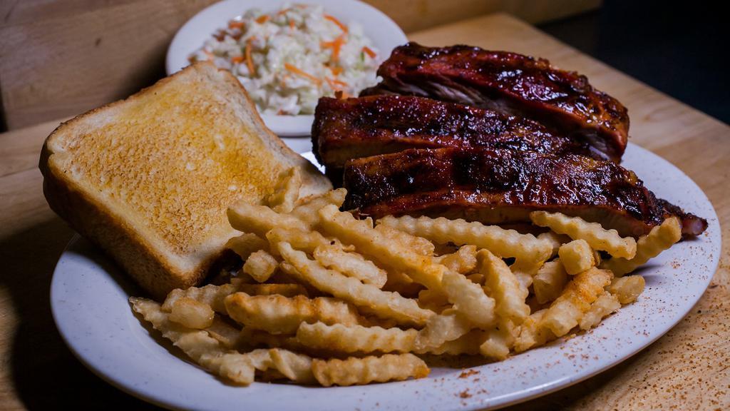 Memphis Style Spare Ribs · Enjoy these tender, slow-smoked ribs hand-rubbed with award-winning seasoning. All dinners include garlic toast and your choice of two: creamy coleslaw, french fries, baked or sweet potato, country vegetables, mashed potatoes, and gravy or bar-b-q beans.