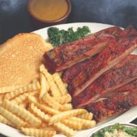 Smokin’ Spare Ribs · All dinners include garlic toast and your choice of two creamy coleslaw, french fries, baked...