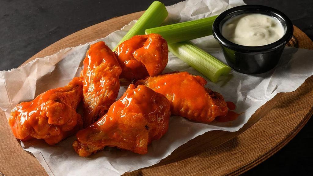 5 Traditional Bone-In Wings · 5 Deep fried bone-in chicken wings seasoned with our signature seasoning blend, served with your choice of our signature wing sauces or dry rubs.. Wing orders include a side of celery and choice of ranch or bleu cheese.