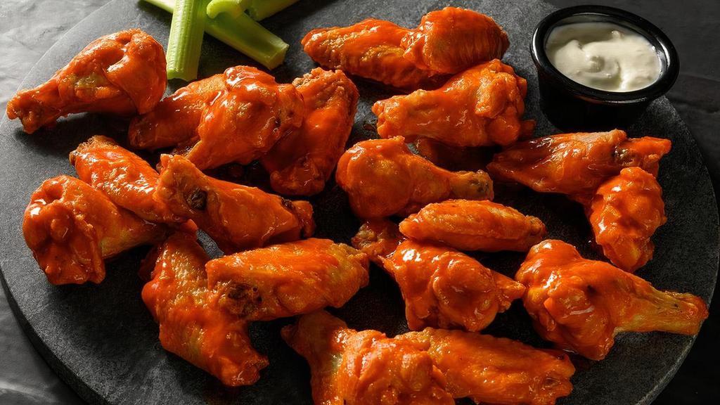 20 Traditional Bone-In Wings · 20 Deep fried bone-in chicken wings seasoned with our signature seasoning blend, served with your choice of our signature wing sauces or dry rubs.. Wing orders include a side of celery and choice of ranch or bleu cheese.