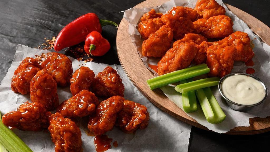 40 Boneless Wings · 40 Deep fried boneless chicken wings seasoned with our signature seasoning blend, served with your choice of our signature wing sauces or dry rubs.. Wing orders include a side of celery and choice of ranch or bleu cheese.