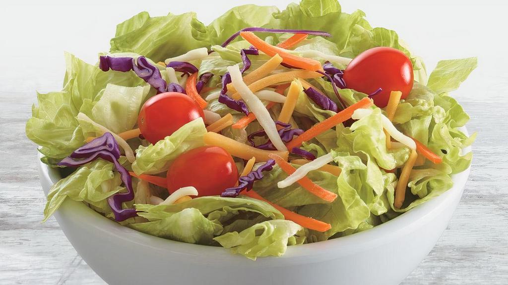 Side House Salad · A bed of lettuce topped with grape tomatoes, shredded carrots, shredded cabbage, and mozzarella/cheddar cheese blend.