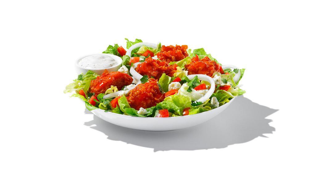 Buffalo Chicken Salad · Mix of romaine and iceberg lettuce stacked with breaded chicken tossed in wing sauce. Topped with tomatoes, bleu cheese, onion, cilantro and choice of dressing.