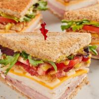 Mcalister'S Club · Smoked turkey, Black Forest ham, bacon, sharp cheddar, Swiss, spring mix, tomato, mayo and M...