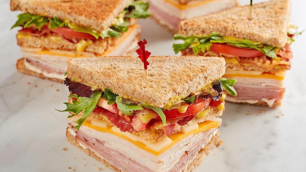 Mcalister'S Club · Smoked turkey, Black Forest ham, bacon, sharp cheddar, Swiss, spring mix, tomato, mayo and McAlister's Honey Mustard™ on wheat..