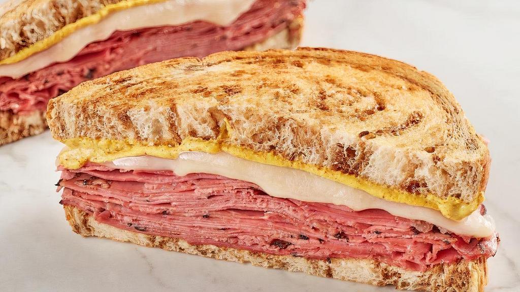 The New Yorker · Corned beef, pastrami, Swiss and spicy brown mustard on marbled rye.