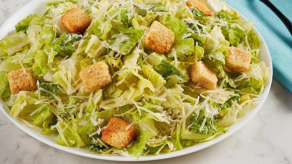 Caesar Salad · Parmesan, croutons and Caesar dressing on romaine lettuce.