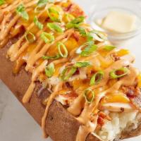 Chipotle Chicken & Bacon Spud · Grilled chicken, bacon, cheddar-jack, chipotle ranch and green onion.