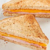 Kids Ham Toastie  · American cheese with ham on toasted wheat bread. Comes with your choice of a side and a Mini...