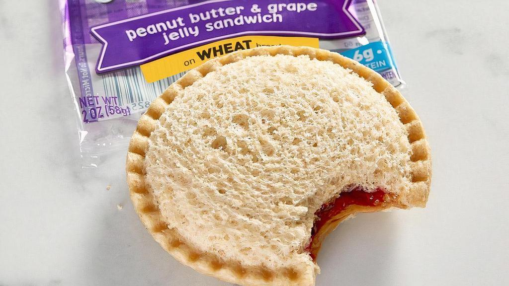 Smucker’S® Uncrustables® Pb&J · Grape jelly and peanut butter on crust-less wheat bread. Comes with your choice of a side and a Mini Chocolate Chip Cookie.