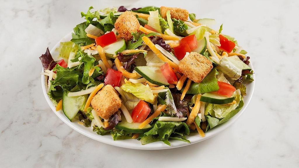 Kids Garden Salad · Crisp cucumbers, tomatoes, cheese and croutons over fresh greens with your choice of dressing and protein: All-Natural Chicken Strips, Ham, or Turkey. Comes with your choice of a side and a Mini Chocolate Chip Cookie.