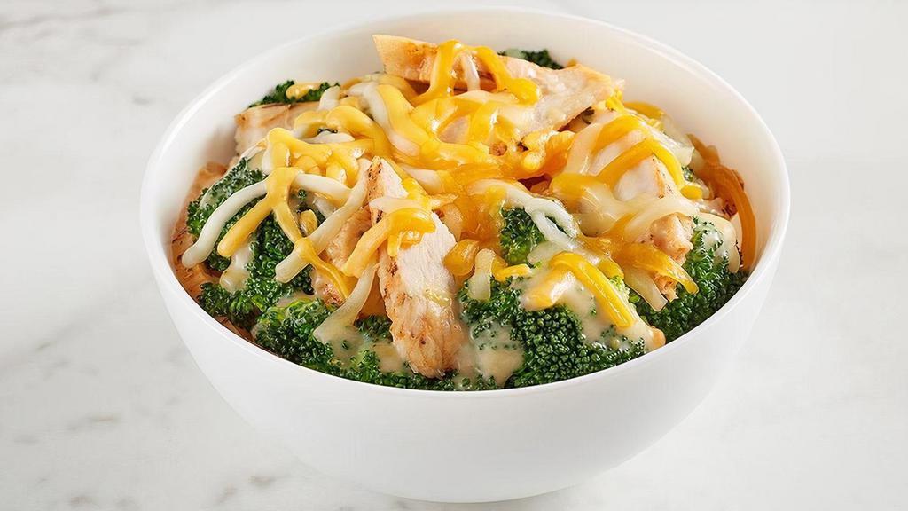 Kids Chicken & Broccoli Bowl · All natural chicken tossed with steamed broccoli, cheddar-jack cheese, and Broccoli & Cheddar Soup. Comes with your choice of a side and a Mini Chocolate Chip Cookie.