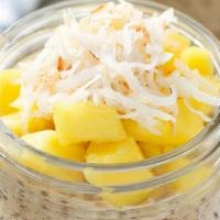 Overnight Oats Mango · Mixed with Oats, Chia, coconut Flakes, almond milk and Topped With Mango