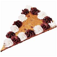 Cookie Cake Slice · Chocolate chip cookie cake topped with chocolate and white icing.