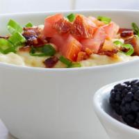 City Grits · Grits with cheese and topped with baked bacon, green onions and tomatoes.