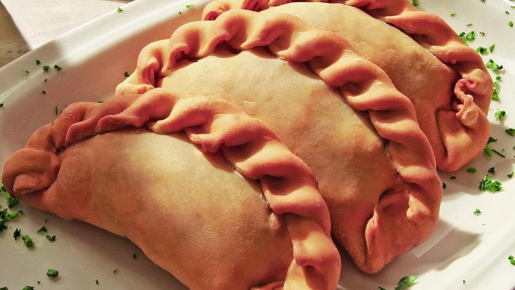 Empanadas (3) · Cuban turnovers filled with either chicken or ground beef.
