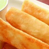 Yuca Frita- Fried Casava Root · Our Cuban potato, boiled, fried until golden crisp, served with garlic sauce.