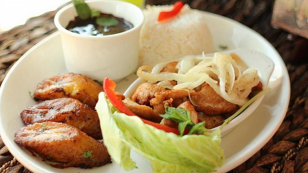 Chicken Chunks · Boneless chunks of breast marinated and deep fried, topped with sauteed onions. Served with white rice, black beans and sweet plantains.