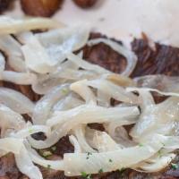 Fried Beef · A flavorful flank steak cooked on the grilled, topped with sauteed onions. Served with white...