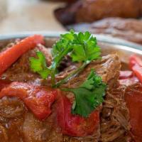 Shredded Beef · Thinly shredded flank beef cooked in tomato base sauce and marinated in garlic, bell peppers...