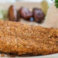 Fish Fillet Crusted · Fish Fillet encrusted with plantain breading. Served with white rice, black beans and sweet ...