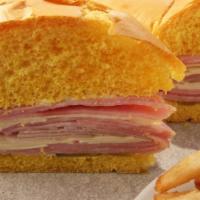 Midnight Sandwich · Midnight Sandwich: Serrano ham, Swiss cheese, pickles, roast pork, mayonnaise on a sweet egg...