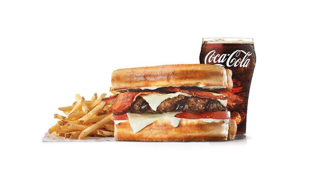 Frisco Angus Burger Combo · Charbroiled Third Pound 100% black angus beef patty, crispy bacon, melted Swiss cheese, tomato, and mayonnaise, served on toasted sourdough. Served with Fries and a Soft Drink.