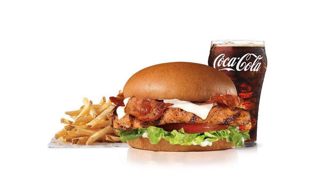 Charbroiled Chicken Club Sandwich Combo · A charbroiled chicken breast, two strips of bacon, melted Swiss cheese, lettuce, tomato and mayonnaise, served on a seeded bun. Served with Fries and a Beverage.