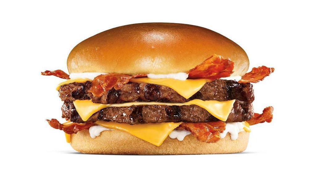 Monster Angus Burger · Charbroiled Third Pound 100% black angus beef patties, 4 strips of bacon, 3 slices of melted American cheese and mayonnaise, served on a toasted potato bun.