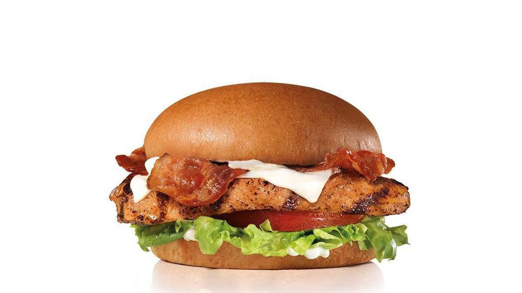 Charbroiled Chicken Club Sandwich · A charbroiled chicken breast, two strips of bacon, melted Swiss cheese, lettuce, tomato and mayonnaise, served on a seeded bun.