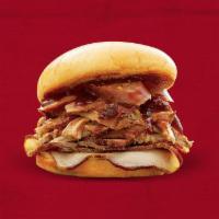Whole Hog® · Sliced Pork, Pulled Pork and Jalapeño Cheddar Hot Links topped with Sweet BBQ sauce on a bun.
