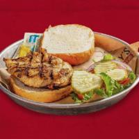 Grilled Chicken Sandwich · Served on a bun with lettuce, tomato, and onion.
