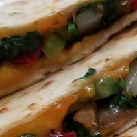 Vegetarian Quesadilla (V) · Grilled mushrooms, spinach, peppers, onions and cheddar cheese served with sour cream