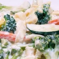 Vegetarian Alfredo (V) · Broccoli, carrots, & zucchini squash tossed in a creamy alfredo sauce served over fettuccine