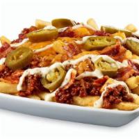Junkyard Fries Or Tots · A heaping pile of fries or tots, chili, cheese, jalapenos, bacon and ranch make up the mount...