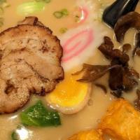 Tonkotsu Ramen · Slow cooked pork bone hearty broth with chashu pork, fried tofu, soft boiled egg, Chinese gr...