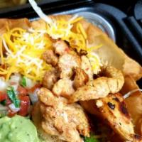 Taco Salad · Grilled Chicken , Steak or Shrimp, in a tortilla bowl with a bed of shredded lettuce, pico d...