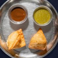 Chunky Chicken Samosa · Free range chicken mixed in a curry marinated and fried in a crispy wheat layer. Served with...
