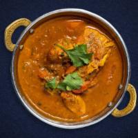 Don'T Curry Love · Your choice of protein cooked in a tomato based onion gravy with freshly ground spices.