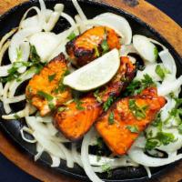 Supreme Salmon Tandoori · Fresh salmon dipped in a yogurt and ground spice marinated and baked in a tandoor clay oven.