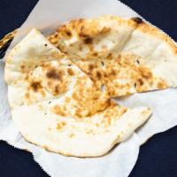 Naan Other Than You · Oven loving with freshly baked bread in a clay oven.