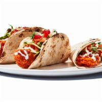 Buffalo Chicken Tacos · Grilled or fried chicken tossed with your choice of wing sauce, topped with cabbage, pico de...