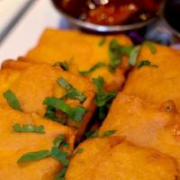 Paneer Pakora · Indian cheese stuffed with mint chutney, potatoes and batter fried.