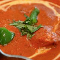 Chicken Tikka Masala · Boneless chicken breast cooked in creamy tomato sauce, onions and bell pepper.