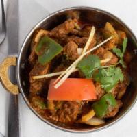 Lamb Kadhai · Boneless lamb pieces cooked with ginger, onion, green pepper and tomatoes.