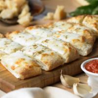 Cheese Bread Stix With Marinara · Folded over pizza dough, stuffed with mozzarella cheese, fresh garlic & butter, baked with m...