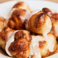 Cinnamon Knots (With Icing) · Our homemade dough knots with butter and sprinkled sugar and cinnamon. Topped with icing.
