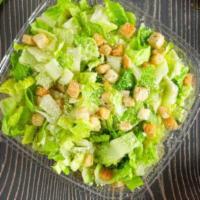 Caesar Salad · Romaine lettuce, crunchy herbs croutons, and Parmesan cheese. Served with caesar dressing.